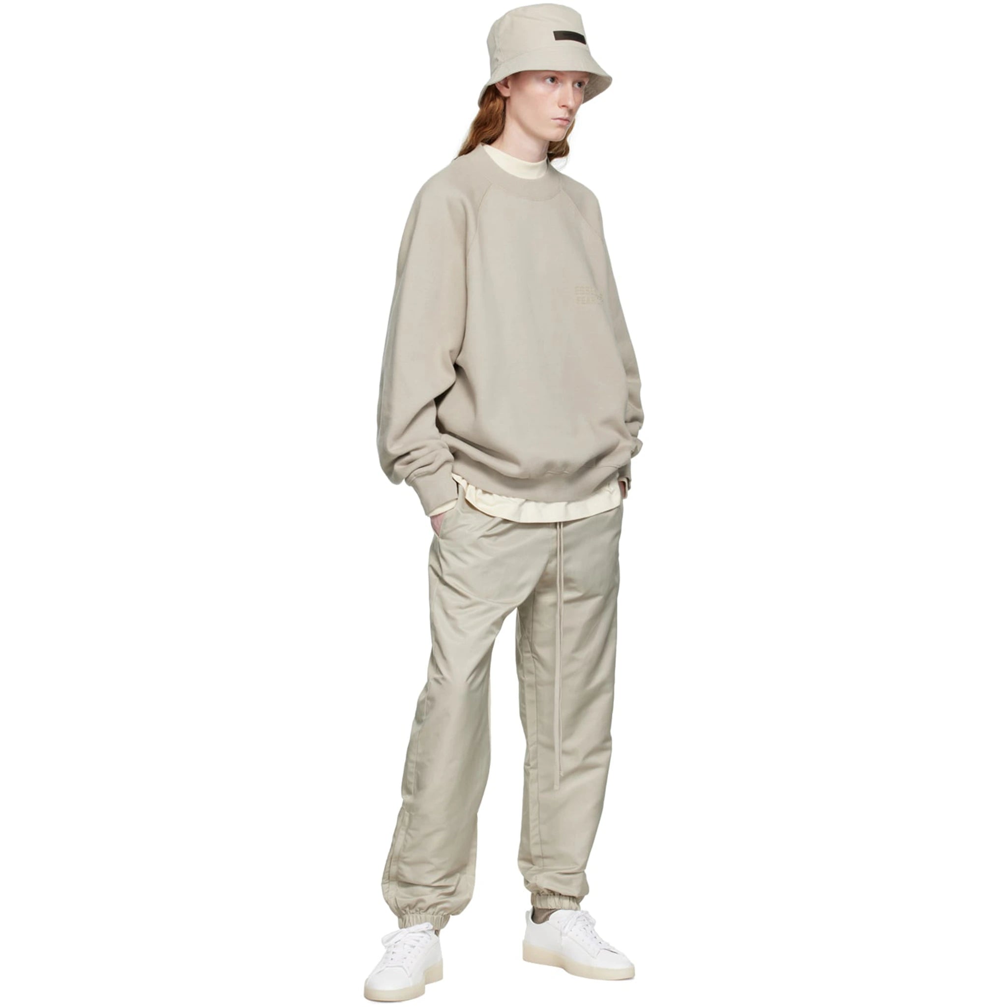 Model view of Fear Of God Essentials Smoke Track Pants (FW22) 130SU222161F